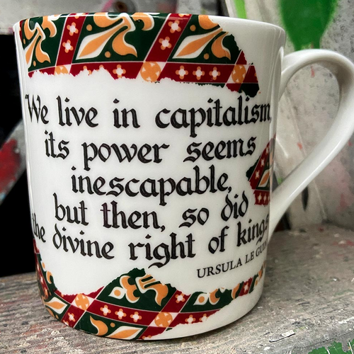 We live in capitalism, its power seems inescapable, but then, so did the divine right of kings - Ursula Le Guin Mug